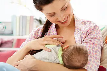 Mother breastfeeding her newborn baby.