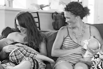 Two mothers breastfeeding their babies.