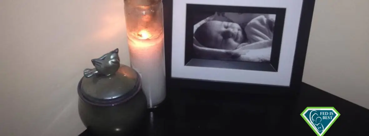 Infant's photo, candle, and urn.