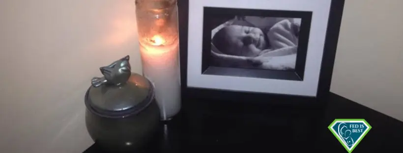 Infant's photo, candle, and urn.