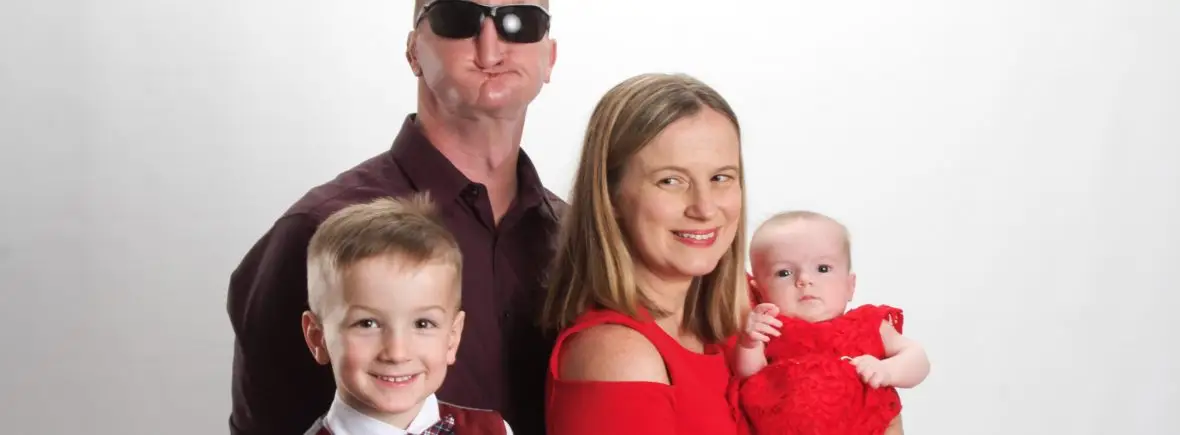 Family portrait: dad, mom, son, and baby.