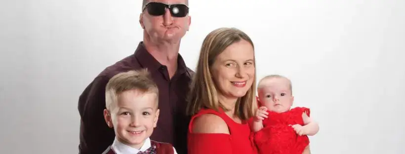 Family portrait: dad, mom, son, and baby.