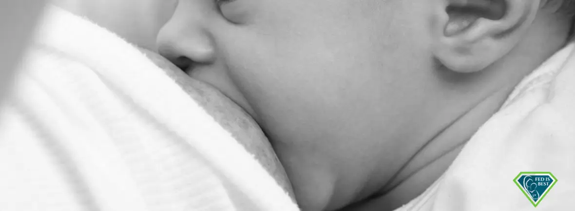 Baby breastfeeding, peaceful moment.