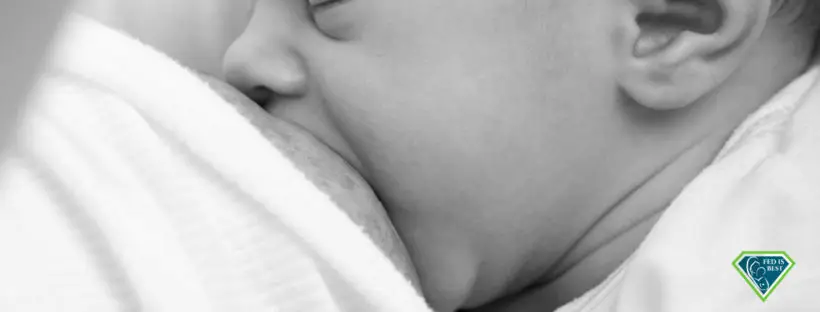 Baby breastfeeding, peaceful moment.